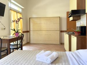 Een bed of bedden in een kamer bij Residence Carioca