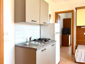 Een keuken of kitchenette bij Residence Carioca