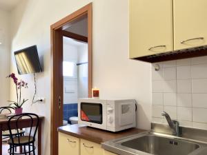 Een keuken of kitchenette bij Residence Carioca