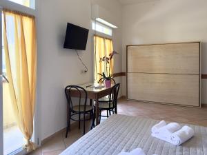 Een bed of bedden in een kamer bij Residence Carioca