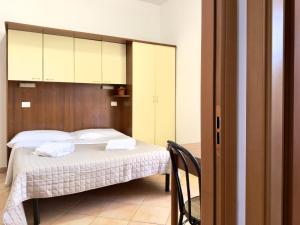 Een bed of bedden in een kamer bij Residence Carioca