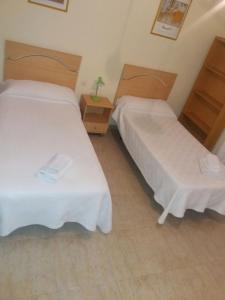 Postel nebo postele na pokoji v ubytování Hostal Jose Luis