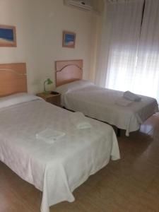 Postel nebo postele na pokoji v ubytování Hostal Jose Luis
