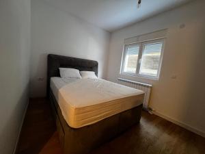 Ένα ή περισσότερα κρεβάτια σε δωμάτιο στο Apartment Zevs by Zafiro