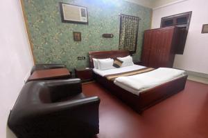 Postel nebo postele na pokoji v ubytování The Kei Suites