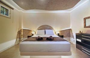 a bedroom with a large bed in a room at Ablaze Luxury Athens in Glyka Nera