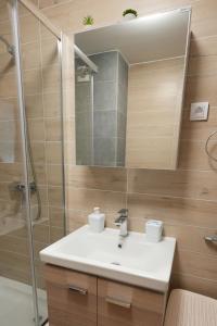 a bathroom with a sink and a shower at Green Hill Susic in Divčibare +33 photos