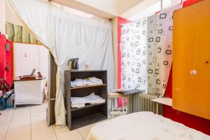 a bedroom with a bed and a wall with numbers on it at Charming Studio in Amaliada, Greece with Private Entrance in Amaliás