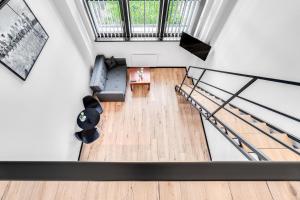 an overhead view of a living room with a staircase at Sweet Apartment Hydral in Wrocław