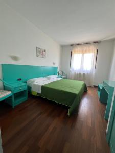 Postel nebo postele na pokoji v ubytování Hotel Verdeneve