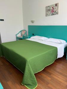 Postel nebo postele na pokoji v ubytování Hotel Verdeneve