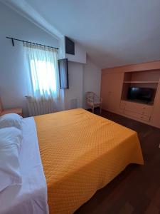 Postel nebo postele na pokoji v ubytování Hotel Verdeneve