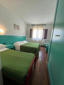 Postel nebo postele na pokoji v ubytování Hotel Verdeneve