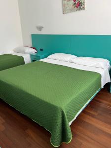 Postel nebo postele na pokoji v ubytování Hotel Verdeneve