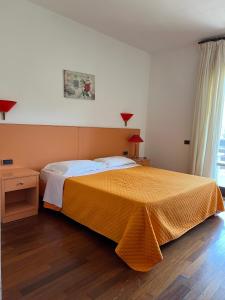 Postel nebo postele na pokoji v ubytování Hotel Verdeneve