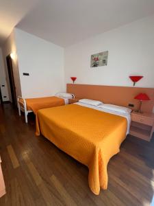 Postel nebo postele na pokoji v ubytování Hotel Verdeneve