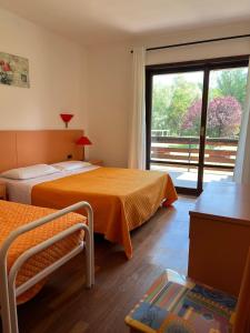 Postel nebo postele na pokoji v ubytování Hotel Verdeneve