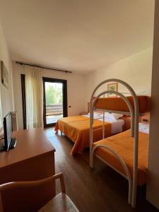 Postel nebo postele na pokoji v ubytování Hotel Verdeneve