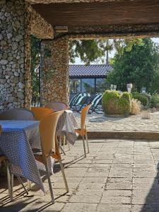 a table and chairs sitting on a patio at Camping Little Oasis in Ezerets