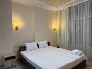 Posteľ alebo postele v izbe v ubytovaní MAGNIT Apartments у самого моря