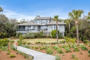a house with a garden in front of it at 19 Eugenia Avenue by Akers Ellis Rentals in Kiawah Island
