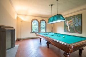 a pool table in a room with a ceiling at Villa Loretino I Ultimate Luxury in Florence in Comeana