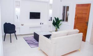 Televisyen dan/atau pusat hiburan di Appartement meublé