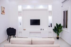 Televisyen dan/atau pusat hiburan di Appartement meublé