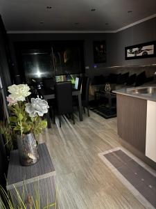 a kitchen and dining room with a table and chairs at A casa da charca in Valga +24 photos