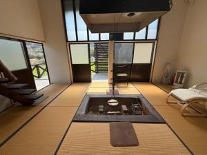 a living room with a pool in the middle of the floor at Itoshima - House - Vacation STAY 19051 in Itoshima