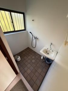 a small bathroom with a sink and a window at Itoshima - House - Vacation STAY 19051 in Itoshima