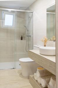 a bathroom with a shower and a toilet and a sink at Aromes d'Espadà in Eslida