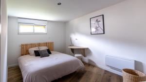 Voodi või voodid majutusasutuse Appartement lumineux à 600m de la plage toas