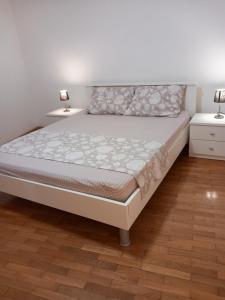 a bedroom with a bed and two night stands at Maris in Banjole +16 photos