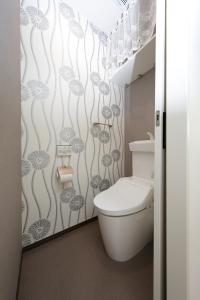 a bathroom with a white toilet in a room at Rana Enoshima - Vacation STAY 94777v in Fujisawa