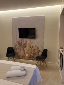 TV a/nebo společenská místnost v ubytování Sunset Beach Club Tropea