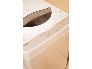 a washing machine with its door open on a counter at Tenjin Tabine - Vacation STAY 24240v in Kanazawa