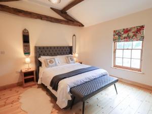 Ένα ή περισσότερα κρεβάτια σε δωμάτιο στο Rose Cottage