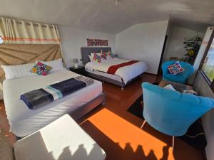 Postel nebo postele na pokoji v ubytování Suma inti lodge