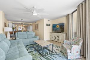 a living room with a couch and chairs and a table at The Summit #9E - Oceanfront in Myrtle Beach