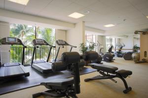a gym with several treadmills and exercise bikes at Halekulani in Honolulu
