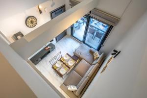 an overhead view of a living room with a couch and table at Maria's Deluxe Apartments in Iraklitsa