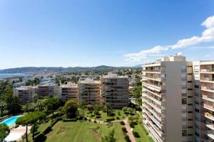 an aerial view of a city with buildings and a park at Luxury Vintage Rooftop Appartment in Antibes