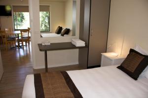 Säng eller sängar i ett rum på Kangaroo Island Seafront