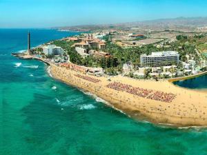an aerial view of a beach and the ocean at Chalet in Maspalomas with Heated Pool in San Bartolomé de Tirajana