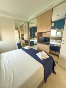 Postel nebo postele na pokoji v ubytování Terracina Seaside Apartments