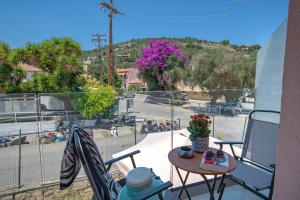 a balcony with a view of a parking lot at Sueño Central Apartments in Gaios