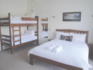 A bunk bed or bunk beds in a room at Off Mountain Accommodation