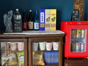 a table with bottles of alcohol on top of it at YAMAGAWA Okesho - Vacation STAY 38332v in Niijimamura +5 photos