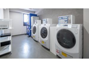 a row of washing machines in a laundry room at Sun Hotel Fukuyama - Vacation STAY 53440v in Fukuyama